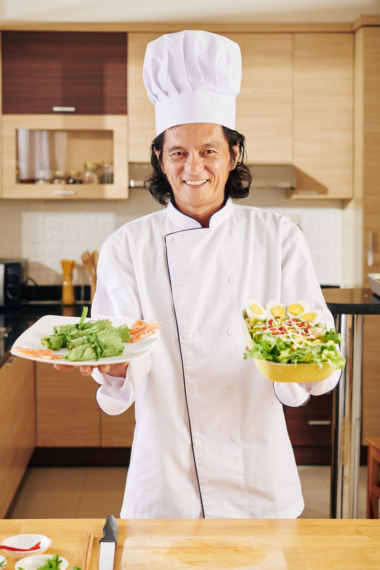 chef-holding-dishes-for-dinner.jpg