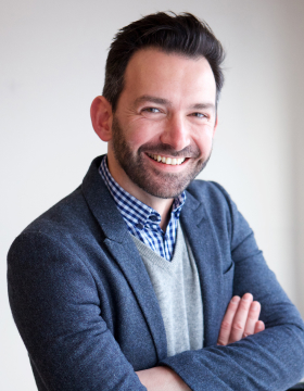 portrait-of-happy-businessman-smiling-in-office-2021-08-28-01-03-54-utc.jpg