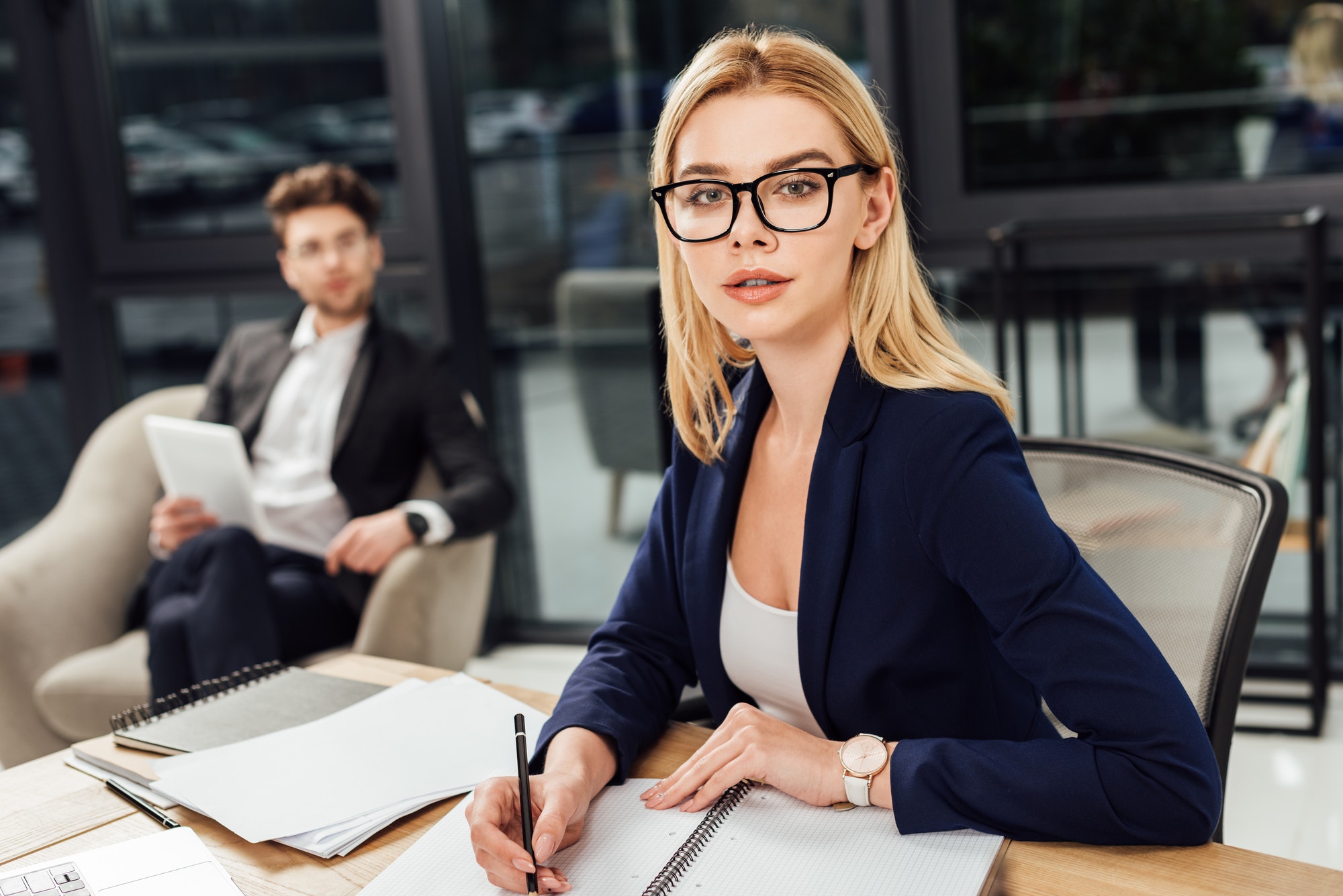 selective-focus-of-businessman-looking-at-businesswoman-in-eyeglasses-that-looking-at-camera-at.jpg